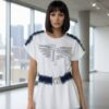 file_1585.jpg Embellished Wing Graphic Mini Dress with Denim Trim